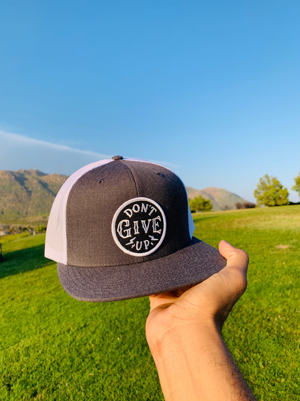 Don't give up white & gray trucker hat
