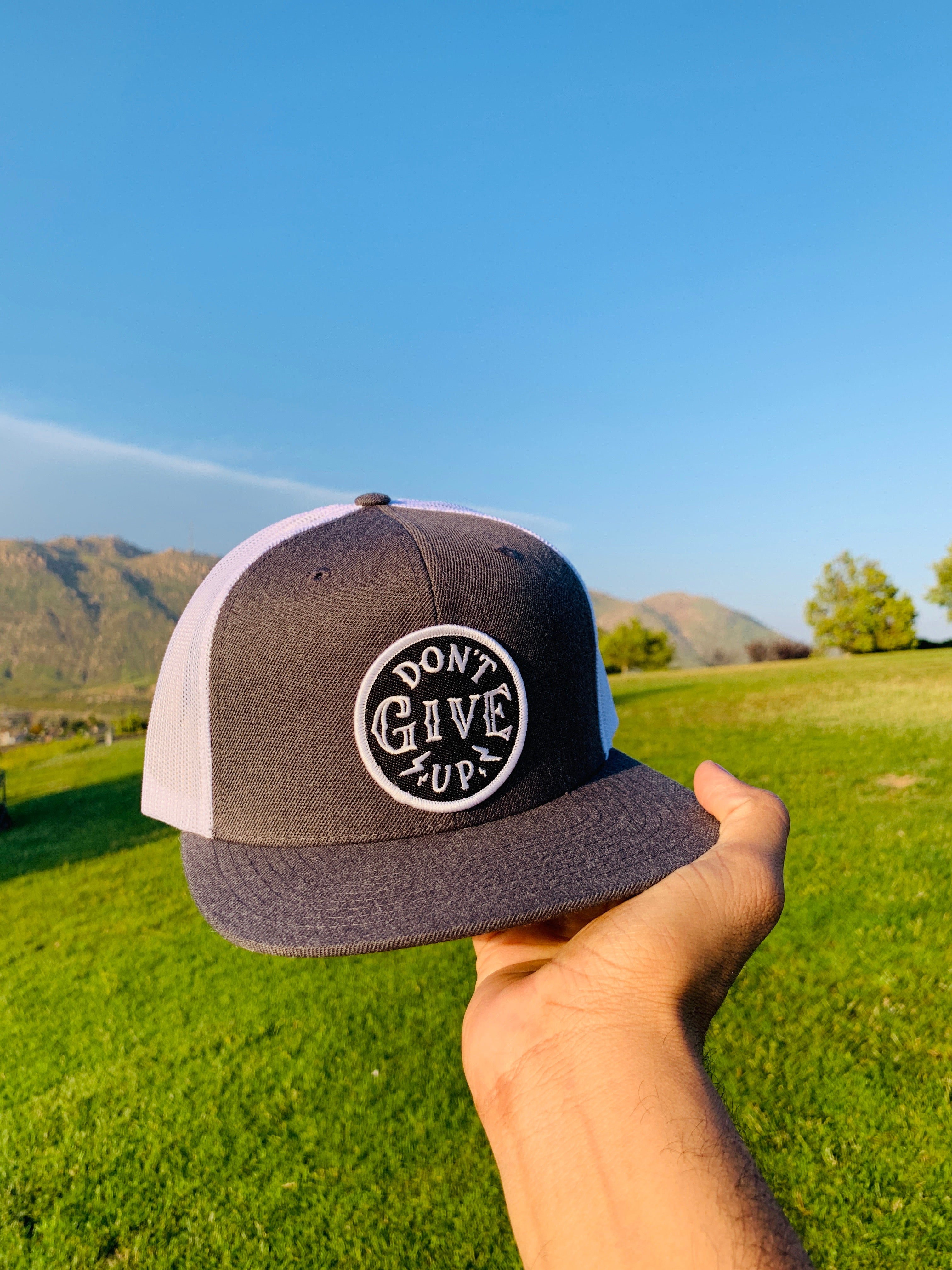 Don't give up white & gray trucker hat