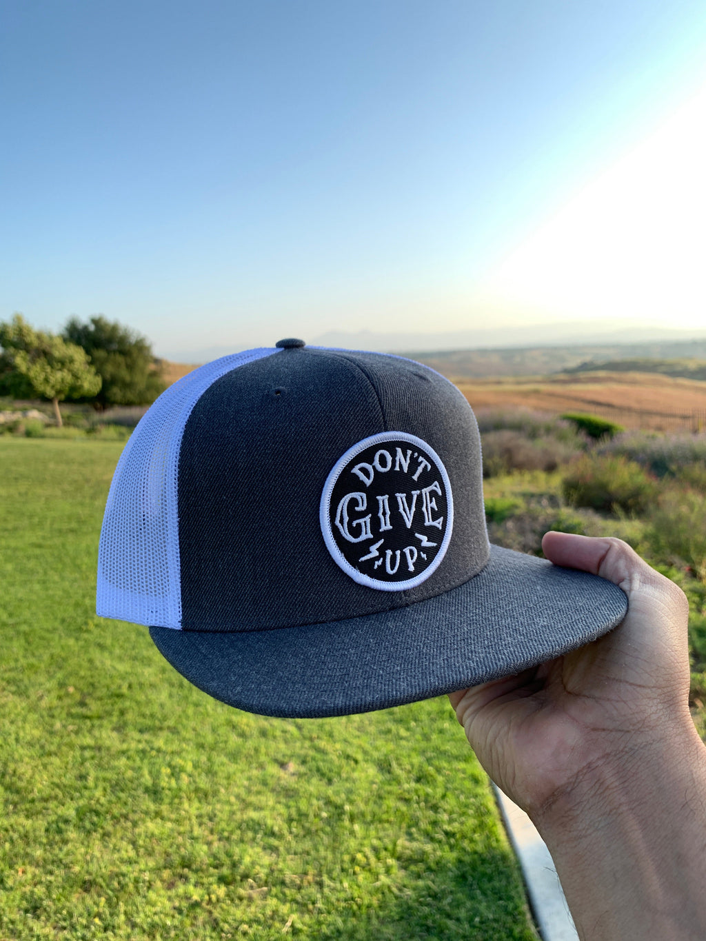 Don't give up white & gray trucker hat